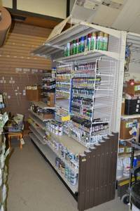lot 17 image: Store Shelving - 4 Foot Double-Sided Sections with Peg Board Backing & Storage Drawer