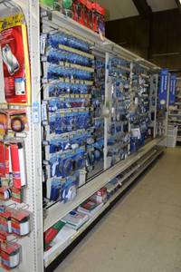 lot 26 image: Store Shelving - 4 Foot Double Sided Section Including Sliding Panels and Shelves with Peg Board Backing & Storage Drawer