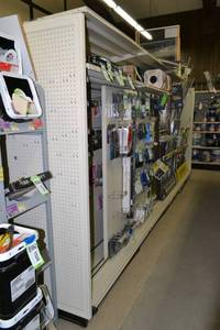 lot 29 image: Store Shelving - 4 Foot Double Sided Section Including Sliding Panels and Shelves with Peg Board Backing & Storage Drawer