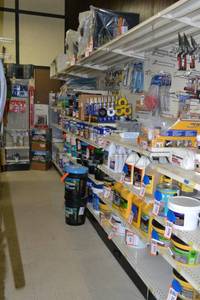 lot 32 image: Store Shelving - 4 Foot Single Sided Sections with Peg Board Backing & Storage Drawer