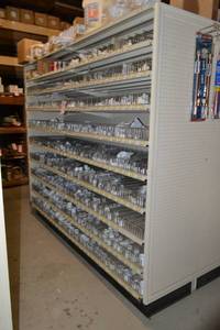 lot 87 image: Store Shelving - 4 Foot Double Sided Section and Shelves with Peg Board Backing and on each end