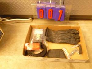 Flat of misc. leather gloves & knives. As shown.