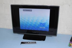 lot 75 image: Toshiba 26 720p LCD HD HDTV High Definition TV with Built-in DVD Player & Remote Control