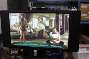 lot 85 image: Samsung 42 Flat Panel Plasma Display  Monitor with Audio Speakers Remote AND ROLLING STAND  CART