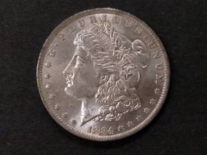 lot 12 image: 1884 O High Grade Morgan Silver Dol...