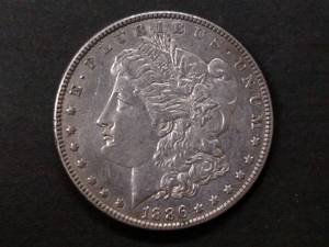 lot 16 image: 1886 Morgan Silver Dollar...