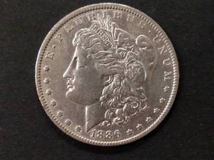 lot 17 image: 1886 O Morgan Silver Dollar...