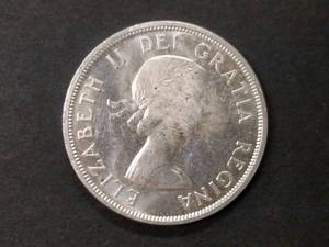 lot 153 image: 1958 Canada .80 Silver Dollar...