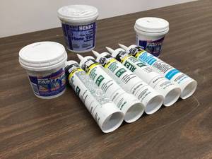 lot 29 image: Mixed Lot Of Hydraulic Cement, Floor Tile Adhesive, Latex Caulk