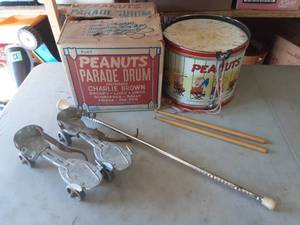 lot 40 image: Vintage Peanuts Drum (1969) With Original Box, Skates & Baton