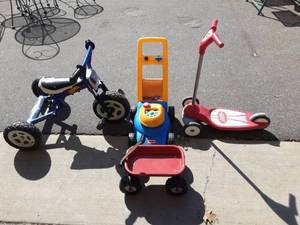 lot 50 image: Radio Flyer Scooter, Small Wagon, Hot Wheel Trike, Little Tikes Mower
