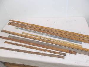 lot 123 image: vintage advertising  measuring sticks