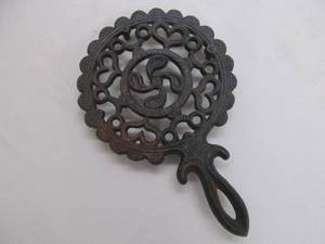 lot 131 image: cast iron trivet
