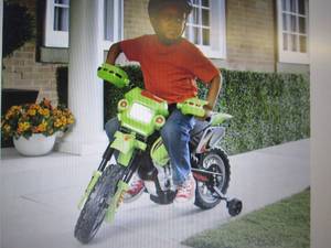 lot 103 image: Green Motorcycle open box Retail $1...
