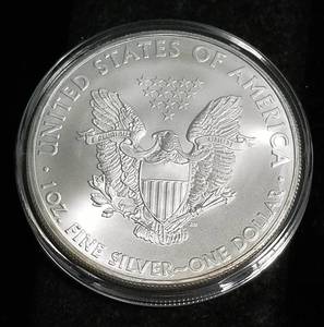 lot 23 image: 2010 AMERICAN SILVER EAGLE 1 TROY OZ. .999 FINE SILVER IN AIRTITE