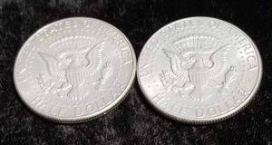 lot 44 image: 2 AU 1964 KENNEDY SILVER HALF DOLLARS