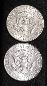 lot 59 image: 2 AU 1964 KENNEDY SILVER HALF DOLLARS