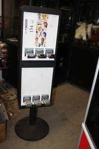 lot 154 image: Sticker 6-Slot Dispenser Stand $.50