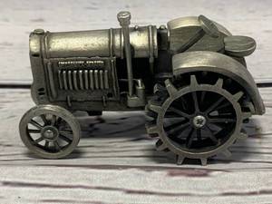 lot 90 image: McCormick Derring Metal Tractor