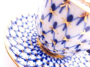 lot 80 image: USSR Lomonosov Blue, White, and Gilded Porcerlain Cup and Saucer