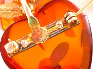 lot 84 image: (3) Amber Stone Bracelets and Amber Apple Pin