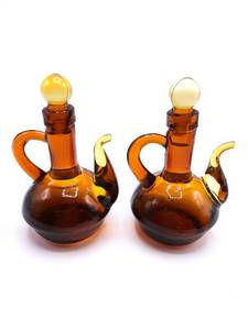 lot 94 image: Pair of Vintage Amber Blown Glass Teapot Shaped Pitcher  Decanter  Cruets with Stoppers