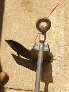 lot 2 image: Craftsman 2 cycle weed trimmer. Lightly used. Tested & works. As shown.
