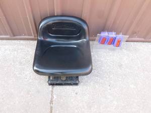 lot 6 image: Craftsman riding mower seat with bracket. New condition. As shown.