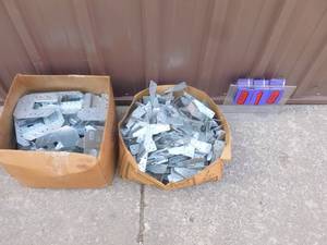 lot 10 image: Qty of 2 boxes of joist hangers & hurricane clips. As shown.