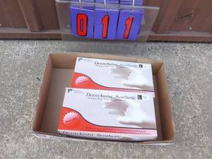 lot 11 image: Qty of 2 Derm Assist vinyl gloves. Size large. As shown.