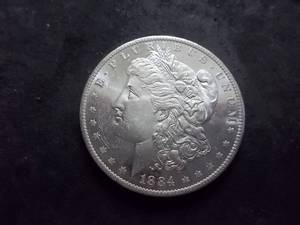 lot 8 image: 1884 O Morgan Silver Dollar