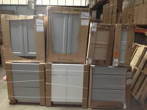 lot 12 image: Asorter of Hampton Bay kitchen and wall Cabinet  diferent sizes and colors