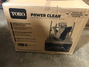 lot 104 image: Toro Power Clear 721 R 21 in. 212 cc Single-Stage Self Propelled Gas Snow Blower not used