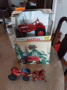 lot 68 image: 2-Farmall Toy Tractors & Other Old Cast Iron