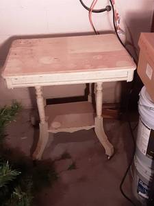 lot 120 image: Vintage Carved Parlor Table On Casters 30x32x30