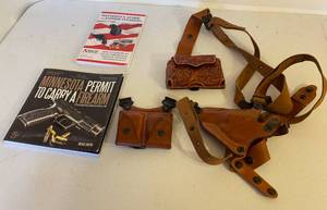 lot 93 image: Leather Gun Holsters and Books