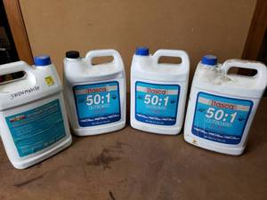 lot 54 image: Itasca 501 Oil and TC-W3 2 Cycle Oil