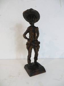 lot 50 image: Carved Wooden Outlaw Figurine