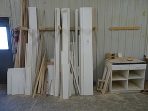 lot 69 image: Misc. wood, white melamine and lower cabinet along the wall