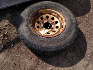 lot 50 image: 6 Lug Rim with ST22575R15 Tire...