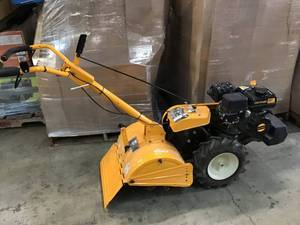 lot 104 image: Cub Cadet View the Collection 18 in. 208cc Rear-Tine Dual-Direction Gas Tiller In good working conditions