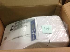 lot 34 image: GE 31,100-Grain Water Softener and Filter in One model Model # GXMH31H not usede retails for $799