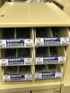 Cabinet with assorted machine screws
