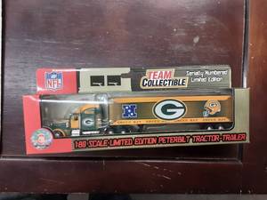 lot 1 image: Green Bay Fleer Collectible NFL Limited Edition Peterbilt 180 Scale