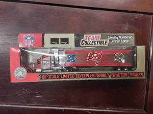 lot 5 image: Bucaneers Collectible NFL Limited Edition Peterbilt 180 Scale