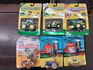 lot 37 image: 6-Ertl John Deere & A Toy Farmer
