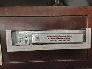 lot 60 image: Speccast Peterbilt 385 Tractor Trailer Nebraska Corn Huskers