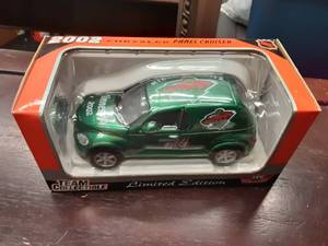 lot 76 image: White Rose Collectibles 124 Scale PT Cruiser