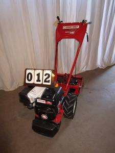 lot 12 image: Troy-Bilt  16 Vertical Tine Tiller
