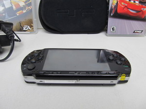 lot 50 image: Working Sony PSP wCords Adapter Case & Games